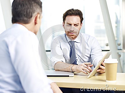 Corporate people discussing business in office Stock Photo