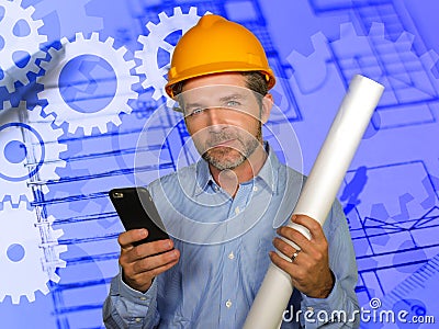 Corporate portrait of attractive efficient and confident architect man holding builder helmet and building construction blueprints Stock Photo