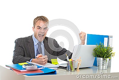 Corporate portrait of young attractive businessman gesturing and celebrating business success excited Stock Photo