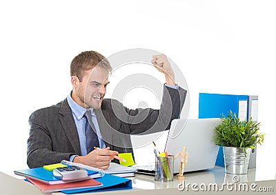 Corporate portrait of young attractive businessman gesturing and celebrating business success excited Stock Photo