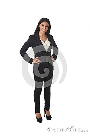 Corporate portrait of young attractive latin businesswoman in office suit smiling happy Stock Photo