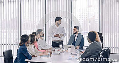 Corporate trainer teaching interns supervising brainstorming disscussion Stock Photo