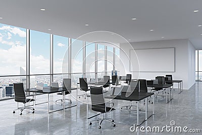 Corporate workplaces equipped by modern laptops in a modern panoramic office in New York City. Stock Photo