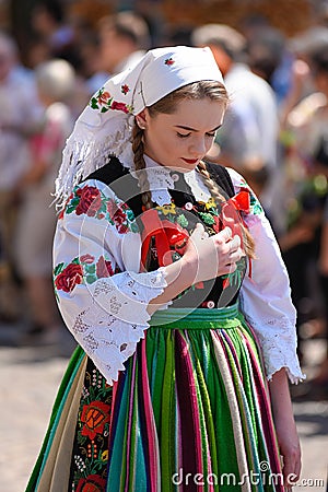Lowicz / Poland - May 31.2018: Corpus Christi church holiday procession. Local women dressed in folk, regional costumes. Editorial Stock Photo