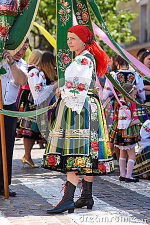 Lowicz / Poland - May 31.2018: Corpus Christi church holiday procession. Local women dressed in folk, regional costumes. Editorial Stock Photo