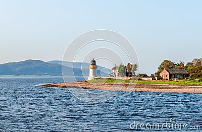 The Corran Point Lighthouse and Lodge on the Corran Narrows, in Loch Linnhe. Stock Photo