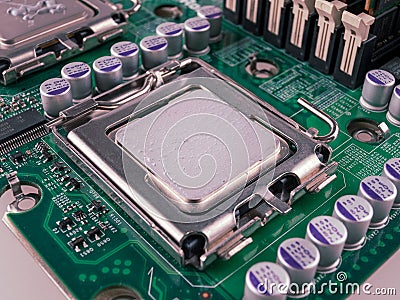 Correct application of thermal conductive paste to the cover of a computer or server circuit before installing the radiator of the Stock Photo