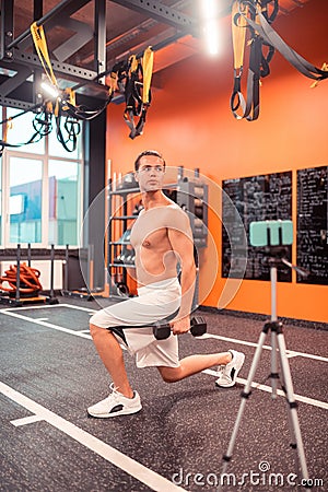 Handsome fit man showing a physical exercise Stock Photo