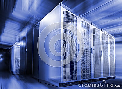 Corridor in large working data center with rack servers and supercomputers with blur and motion Stock Photo