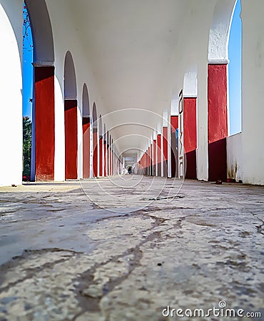 Corridor pillars low angle symmetry shot at morning from unique perspective Stock Photo