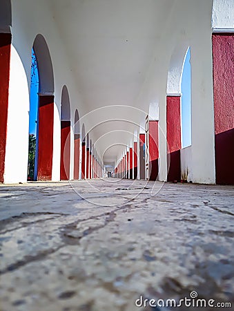 Corridor pillars low angle symmetry shot at morning from unique perspective Stock Photo