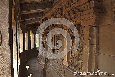 Corridor with pillars Parikrama , Durga temple, Aihole, Bagalkot, Karnataka. The Galaganatha Group of temples. Figure of Vishnu is Stock Photo