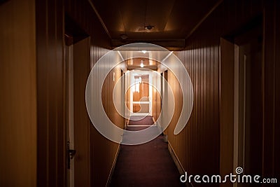 Corridor in a small hotel with brown walls Stock Photo