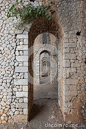 Corridors and arches in the Temple of Jupiter Anxur, an Ancient Roman temple that is located in Terracina, Latina, Italy Editorial Stock Photo