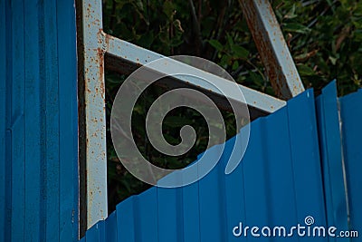 Corrugated blue metal fence with support profile Stock Photo