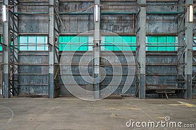 Corrugated iron wall in a warehouse Stock Photo