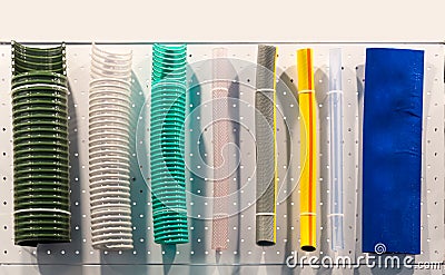 Corrugated plastic tubes and rubber water hoses Stock Photo