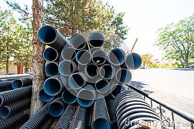 Corrugated water pipes of large diameter prepared for laying Stock Photo