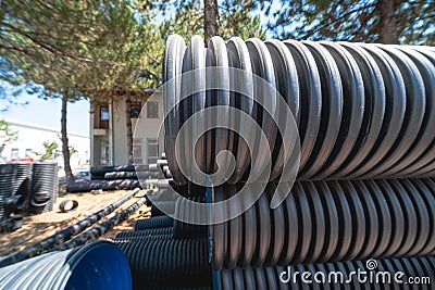 Corrugated water pipes of large diameter prepared for laying Stock Photo