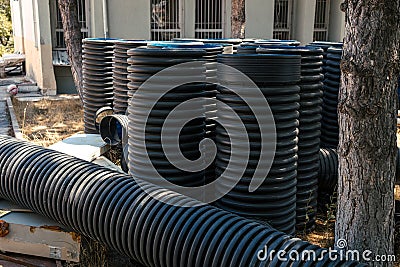 Corrugated water pipes of large diameter prepared for laying Stock Photo