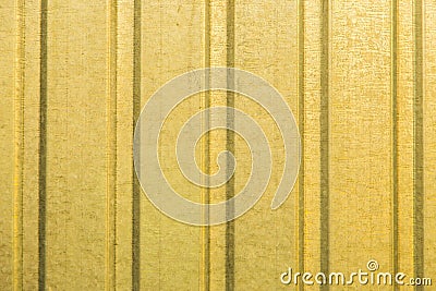 Corrugated yellow metal sheet wall Stock Photo