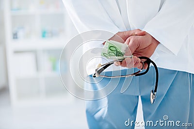 Corrupt doctor with a stethoscope Stock Photo