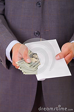 Corrupt politician put some money inside of an envelope Stock Photo