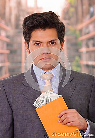 Corrupt politician received money from a crook inside of a yellow envelope Stock Photo