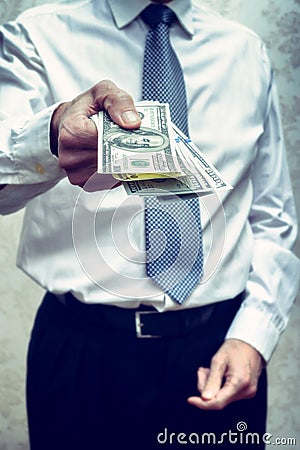 Corrupted businessman, or politician, offering a Dollar banknote Stock Photo