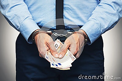 Corruption and bribery concept - arrested official with money Stock Photo