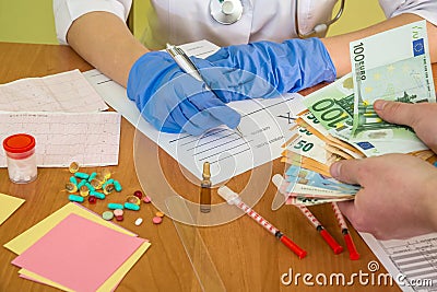 Corruption in medicine, patient gives euro banknotes Stock Photo