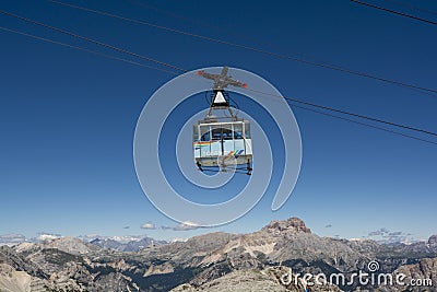 Cortina d`Ampezzo, Dolomites, Italy - July, 8, 2022 : Cable car or Gondola lift ascending from Cortina d`Ampezzo to Tofana di Editorial Stock Photo