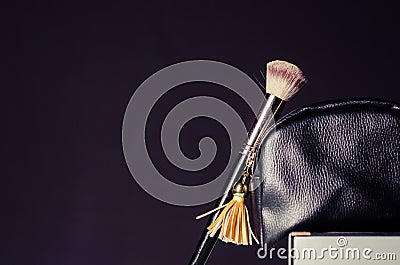 Cosmetic bag with accessories, on a dark background Stock Photo