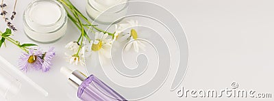 Cosmetic banner with organic creams and wild flowers Stock Photo