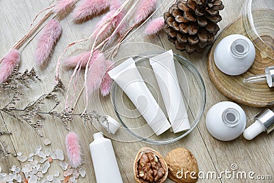 Cosmetic bottle containers packaging with winter seasonal theme, Blank label for organic branding mock-up. Stock Photo
