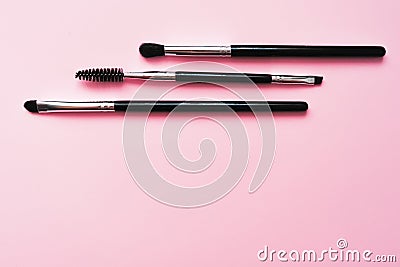 Cosmetic brushes for makeup on a pink background, fashion and beauty Stock Photo