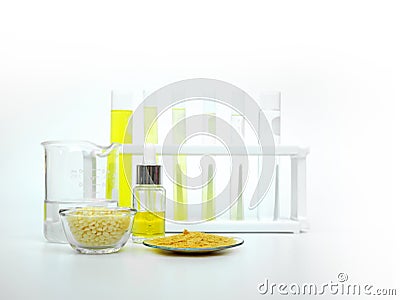 Cosmetic chemicals ingredient on white laboratory table. Carnauba Wax Flakes Stock Photo