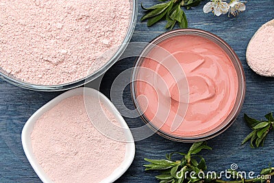 Cosmetic clay. Pink cosmetic clay in different types on a blue wooden table. face mask and body. care products. spa. top view Stock Photo