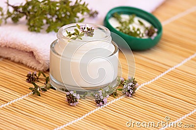 Cosmetic cream and thyme Stock Photo