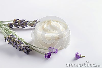 Cosmetic jar with face cream decorated with lavender flowers, herbal cosmetics concept Stock Photo