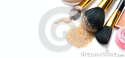 Cosmetic liquid foundation or cream, loose face powder, various brushes for apply makeup. Make up concealer smear and powder Stock Photo