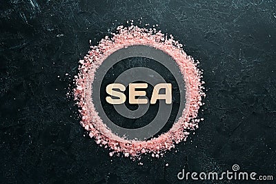 Cosmetic pink salt with the inscription SEA. Stock Photo