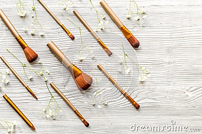 Cosmetic set with brushes on woman table background top view Stock Photo