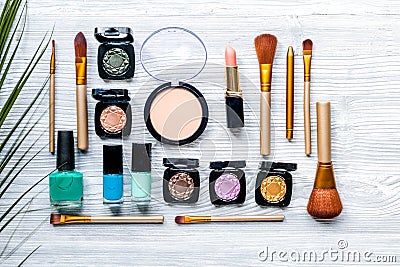 Cosmetic set with eye shadow on woman table background top view Stock Photo