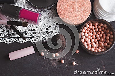 Cosmetics on a dark background, close-up. Face care, make-up. Items for applying makeup. The world of a woman Stock Photo