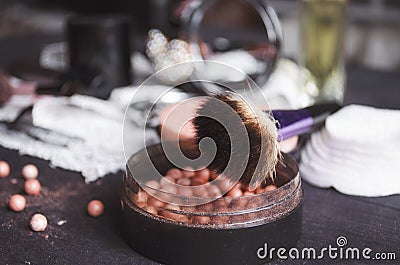 Cosmetics on a dark background, close-up. Face care, make-up. Items for applying makeup. The world of a woman Stock Photo