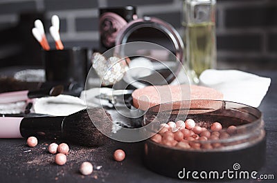 Cosmetics on a dark background, close-up. Face care, make-up. Items for applying makeup. The world of a woman Stock Photo