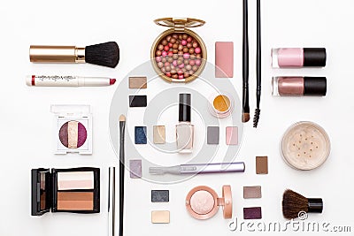 Cosmetics for facial makeup: brushes, powder, lipstick, eye shadow, nail Polish, trimmer and other accessories on white background Stock Photo