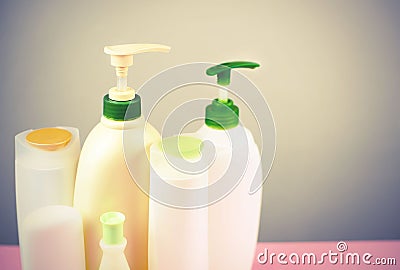 Cosmetics for hair and body care white bottles on a gray background Natural organic product Copy space selective focus Stock Photo