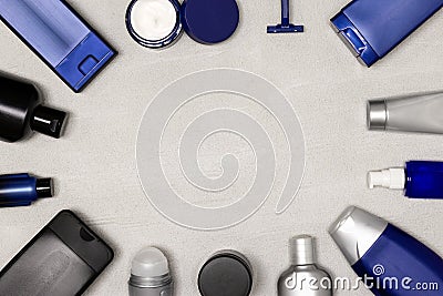 Cosmetics for man hygiene, hair and skin care. Beauty essentials. Male grooming products frame on cement background Stock Photo